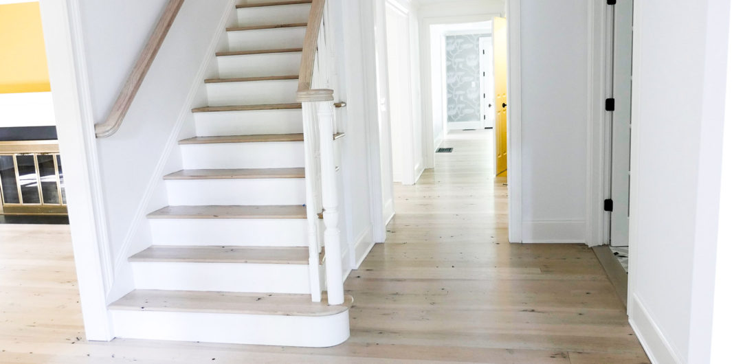 Freshly renovated home in Connecticut with light wood floors and white walls