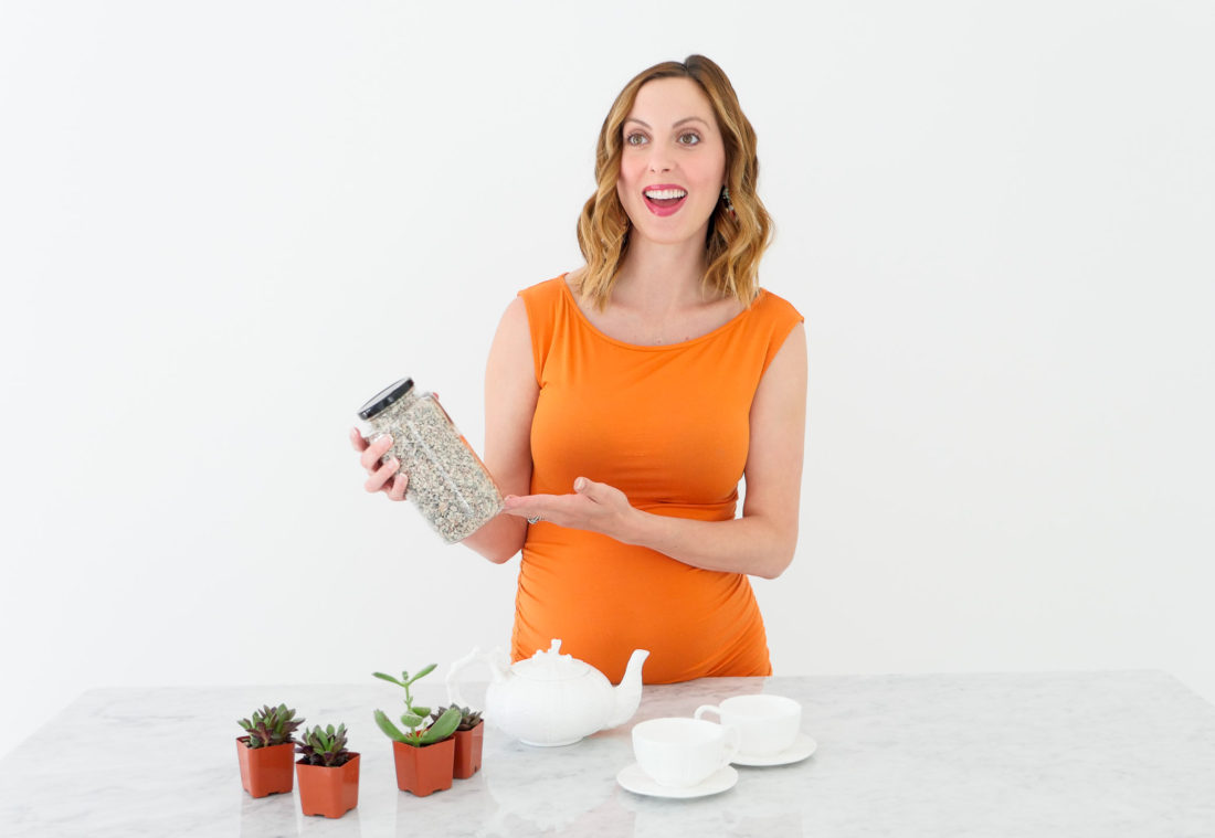 Eva Amurri Martino of lifestyle blog REZTT wearing an orange maternity dress at 34 weeks pregnant shooting a craft segment in her studio in connecticut