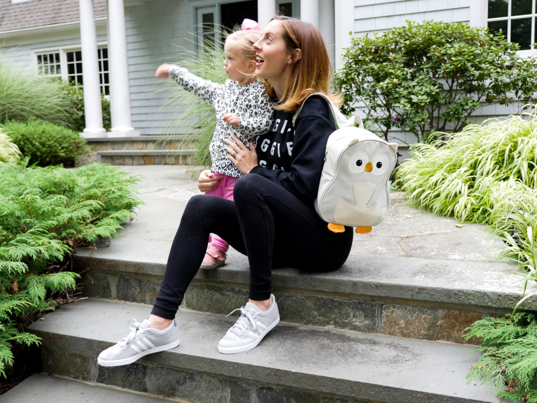 Eva Amurri Martino of lifestyle blog REZTT with her daughter Marlowe sitting on their front steps together waiting to go off to school