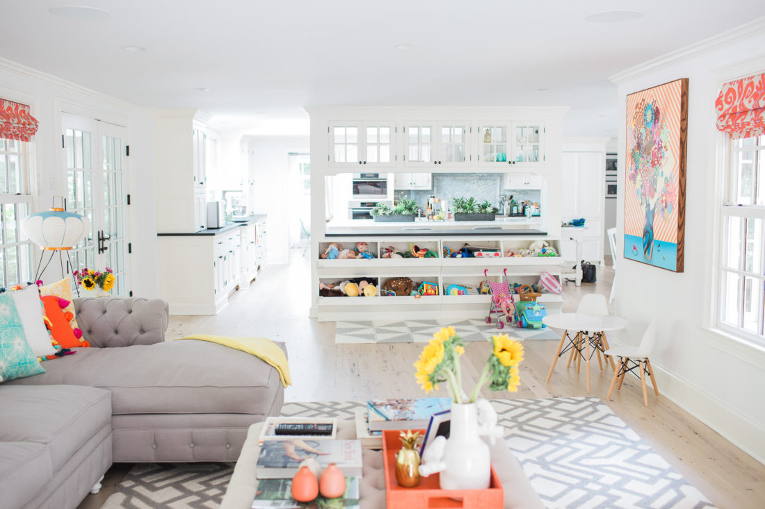 View of the custom play area of Eva Amurri Martino's family room in connecticut featuring built in toy storage and an open floor plan