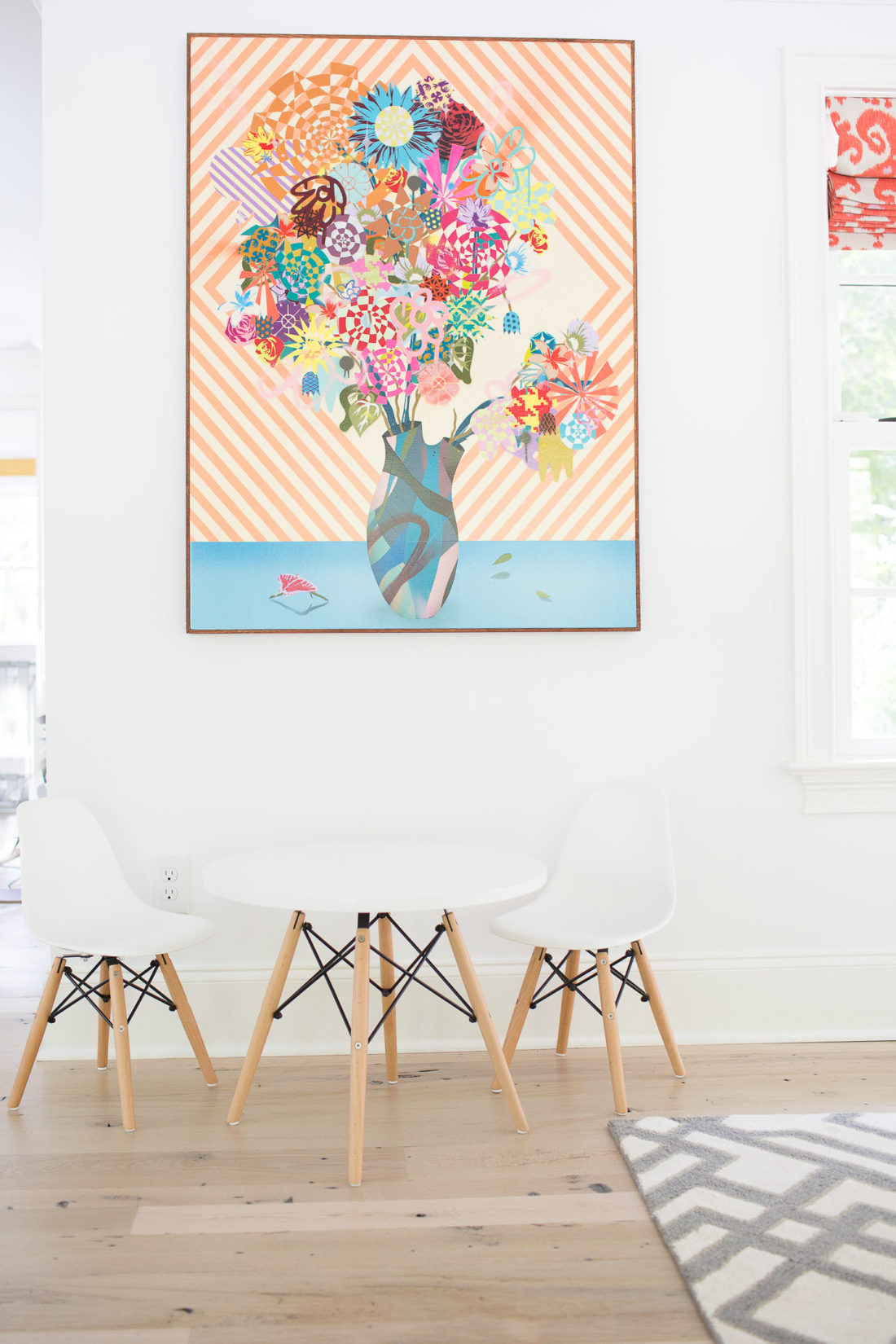Miniature mid century modern eames style play table and chairs in Eva Amurri Martino's family room at her home in Connecticut