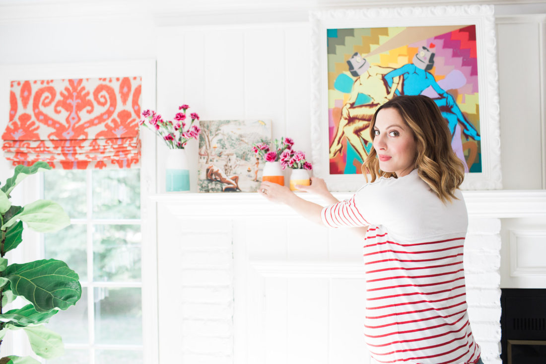 Eva Amurri Martino of lifestyle blog REZTT styling the multicolored mantlepiece in her family room