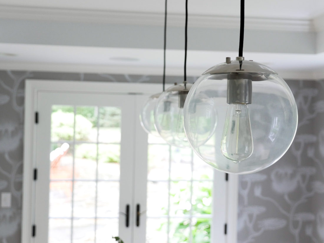 A close up of the lighting in the bright and airy dining room of REZTT's Eva Amurri Martino