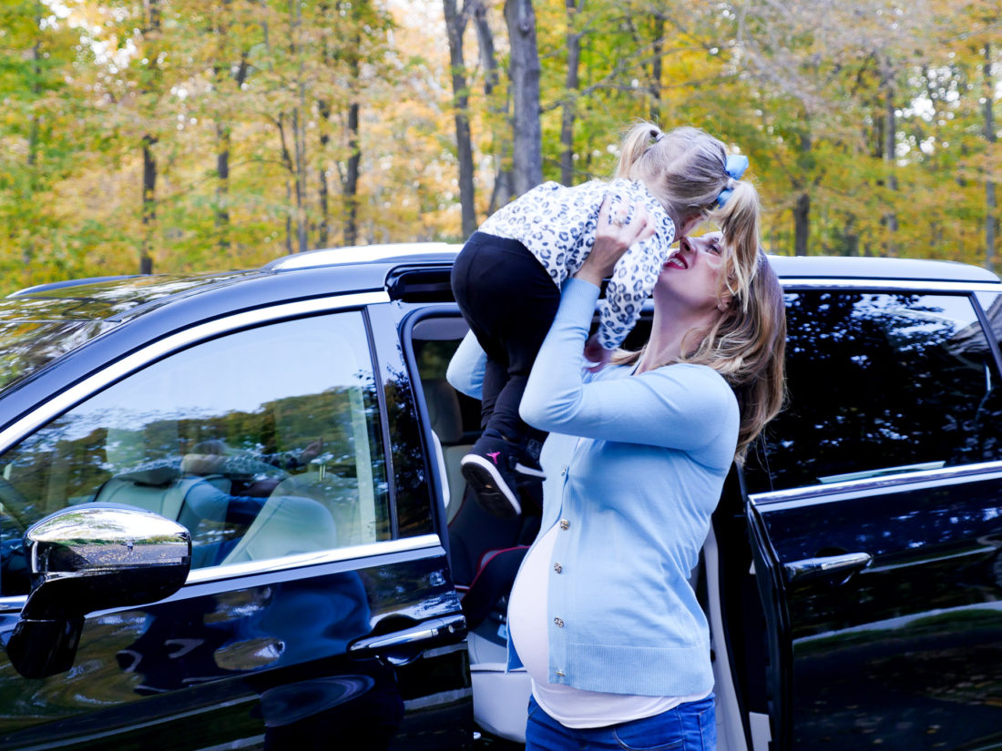 Eva Amurri Martino pictured at nine months pregnant, lifting daughter Marlowe in to the air