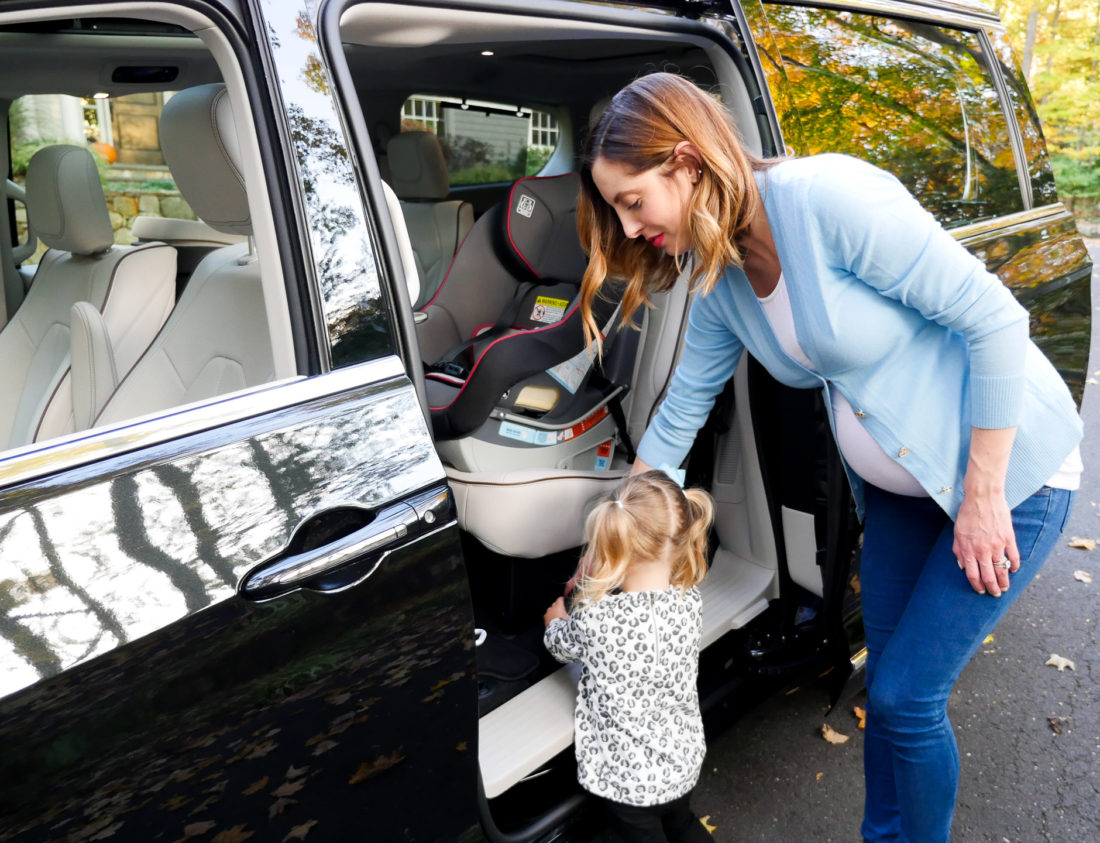 Eva Amurri Martino pictured using the attached vacuum cleaner in her new Chrysler Pacifica