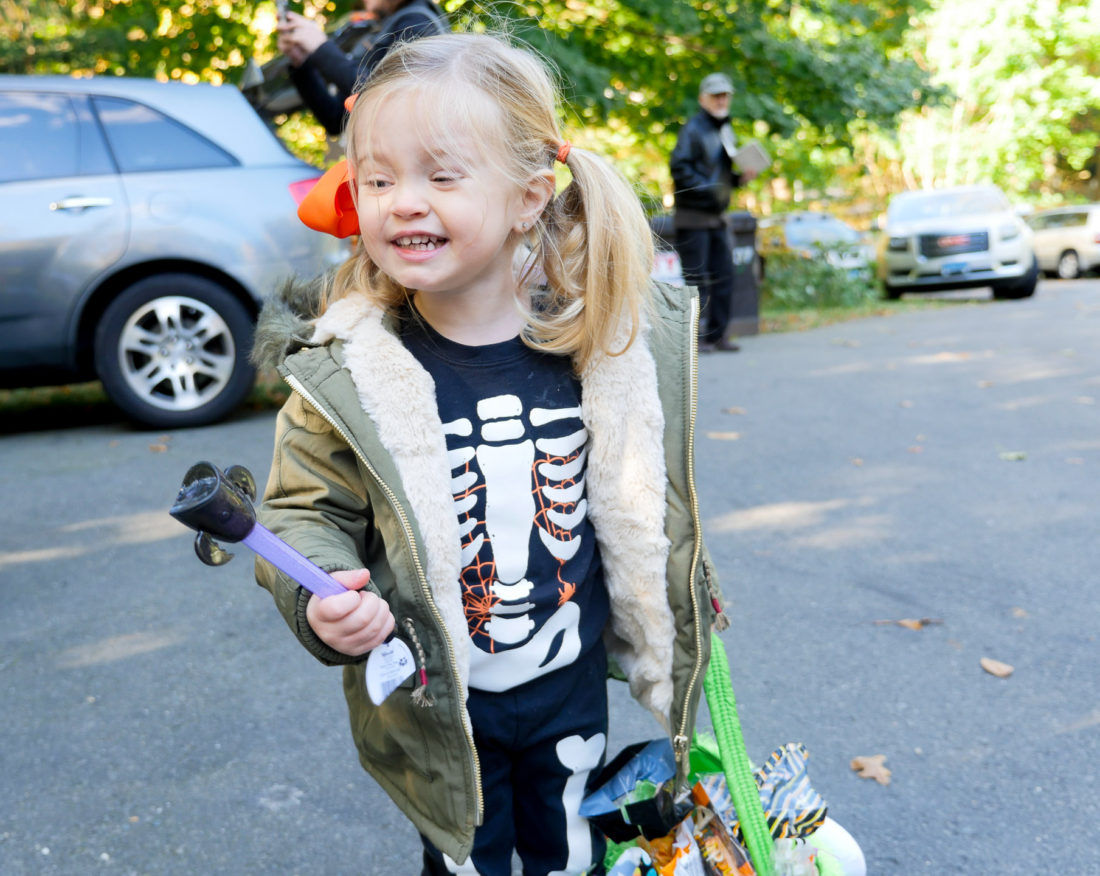 Marlowe Martino trick or treating in a skeleton costume on halloween