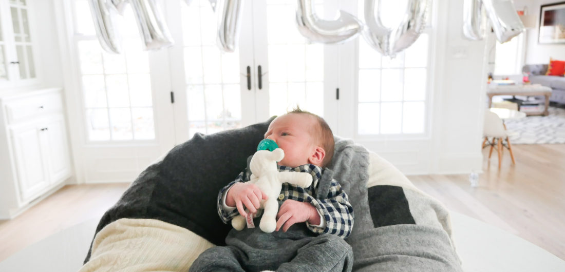 Lifestyle and Motherhood blogger Eva Amurri Martino's newborn son, Major James, is pictured in the foreground with a balloon sign spelling out his name at the Sip And See party in his honor at her connecticut home