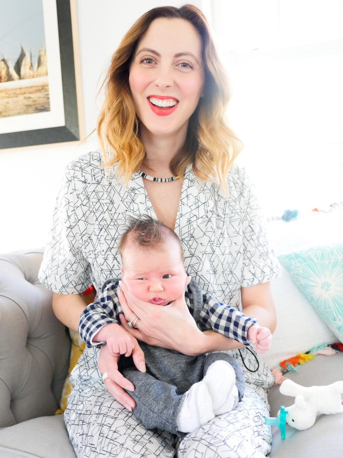 Eva amurri Martino of lifestyle and motherhood blog REZTT, holding newborn son Major James at his Sip And See at home in Connecticut