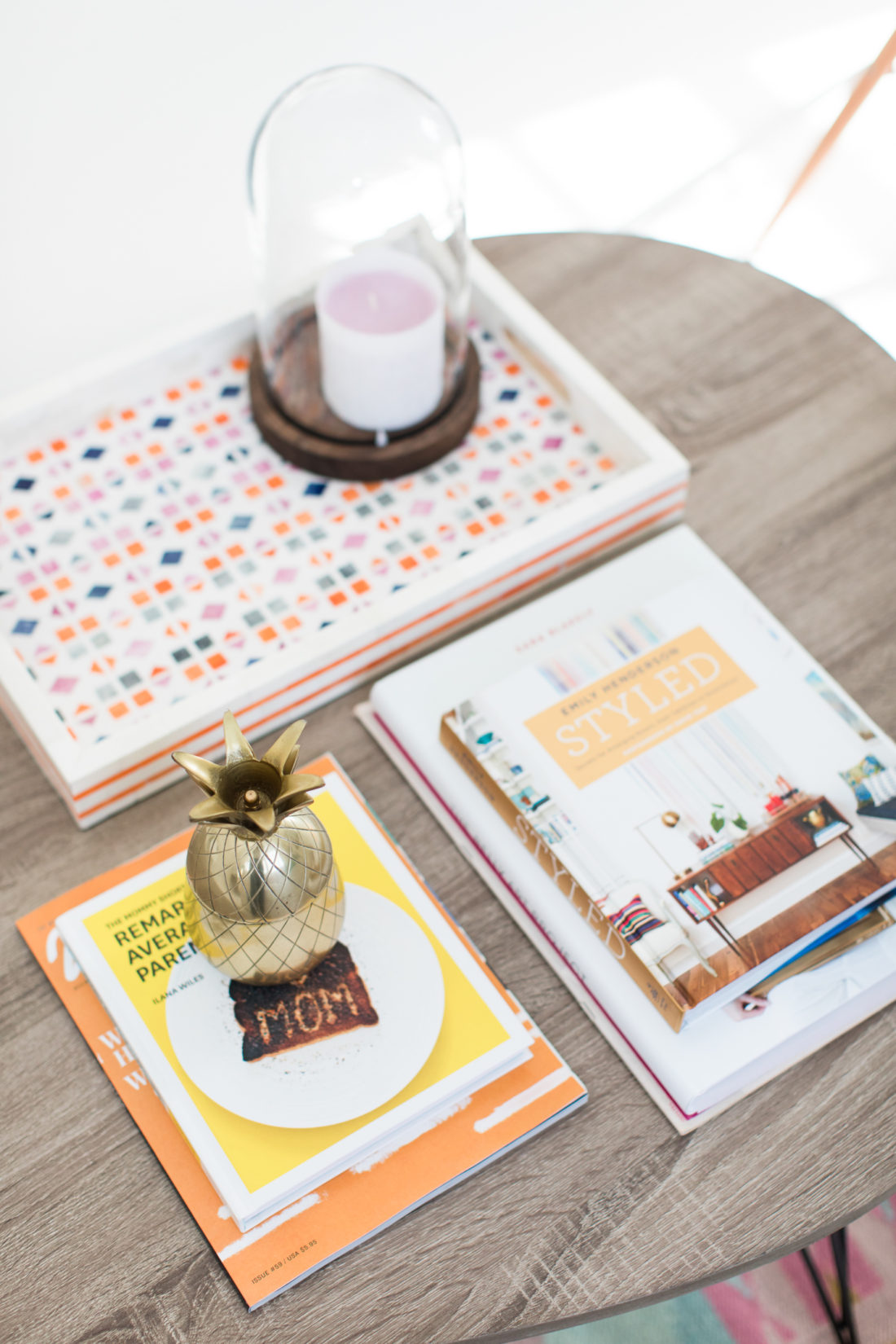 The coffee table scattered with books and objects in the REZTT studio