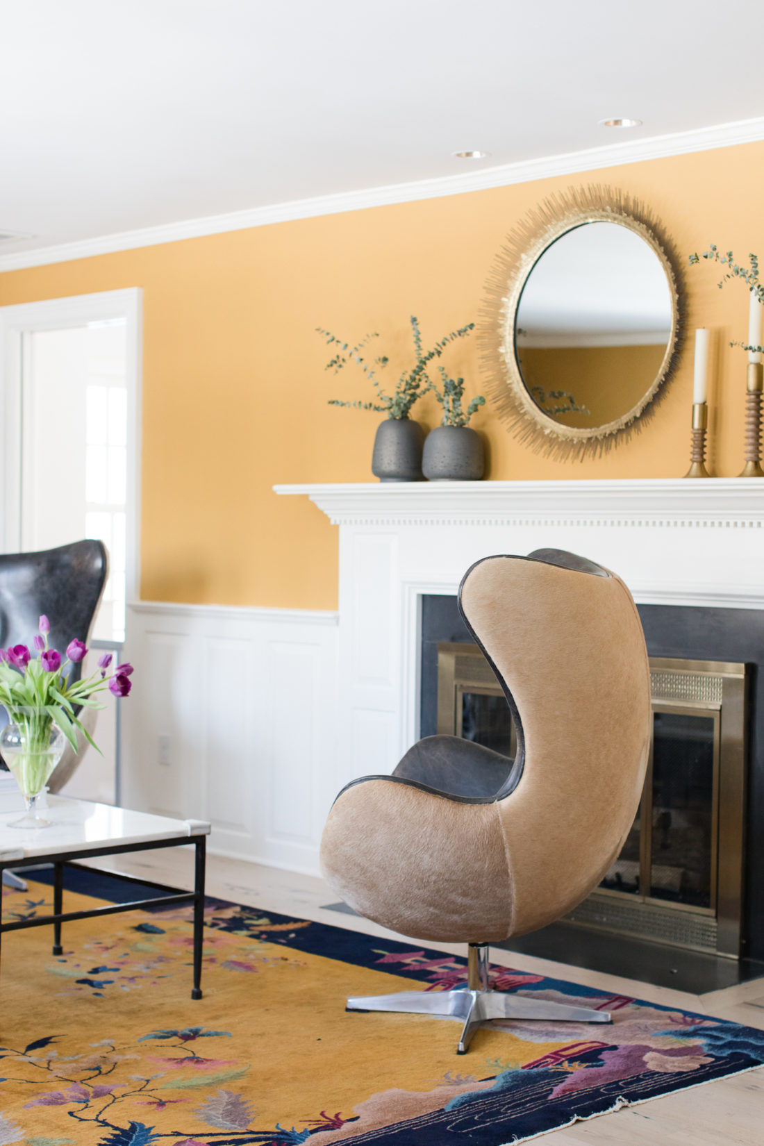 The elegant and glamorous formal living room in Eva Amurri Martino's Connecticut home, featuring a hyde-covere wingback swivel chair
