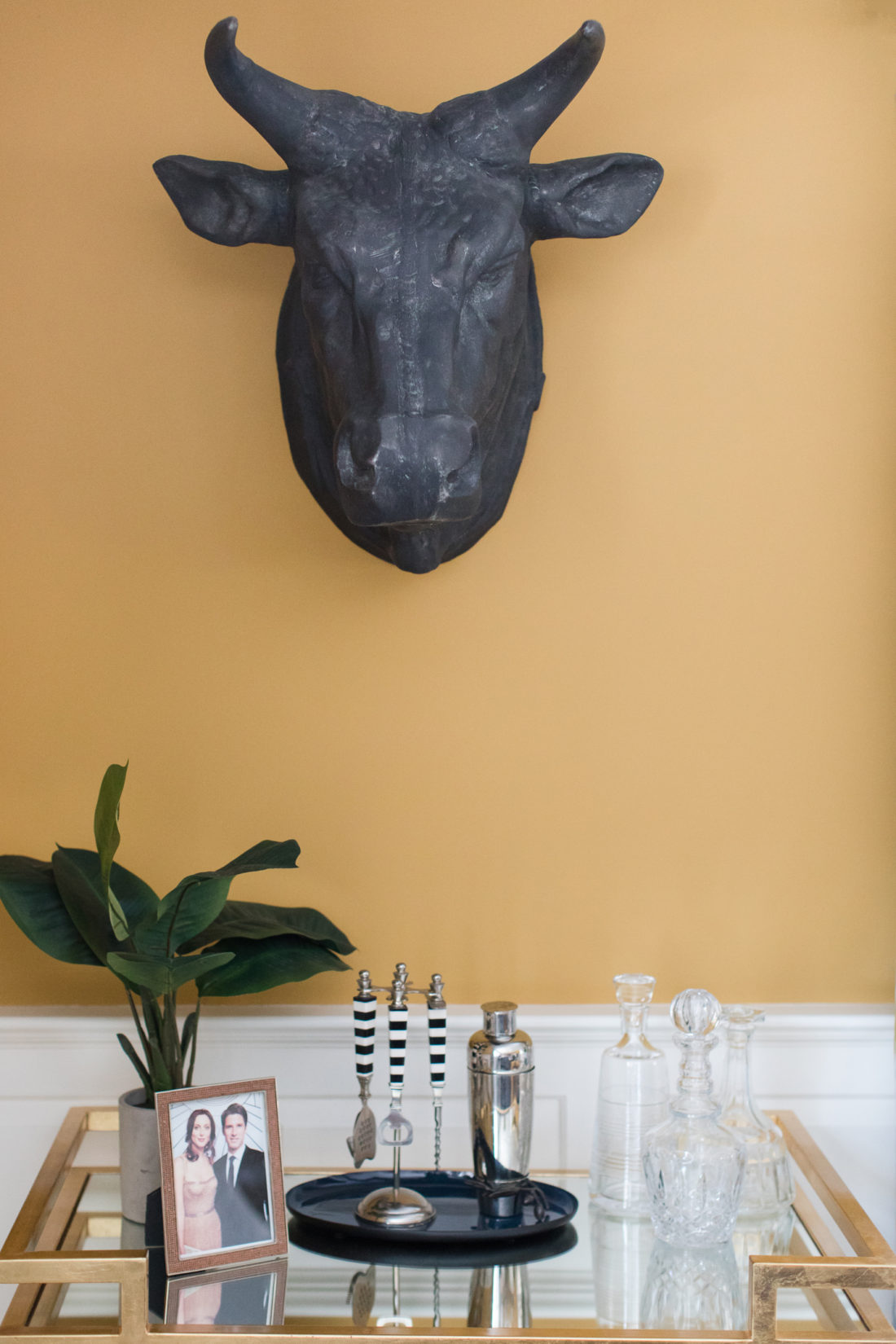 The golden deco bar cart in the formal living room of Eva Amurri martino's Connecticut home