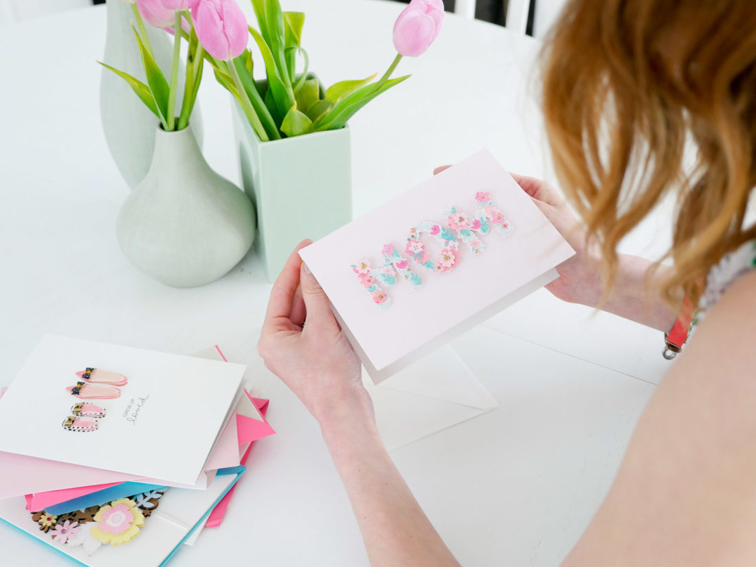 Eva Amurri Martino selects a floral, raised motif Mother's Day card to fill out for her Mother