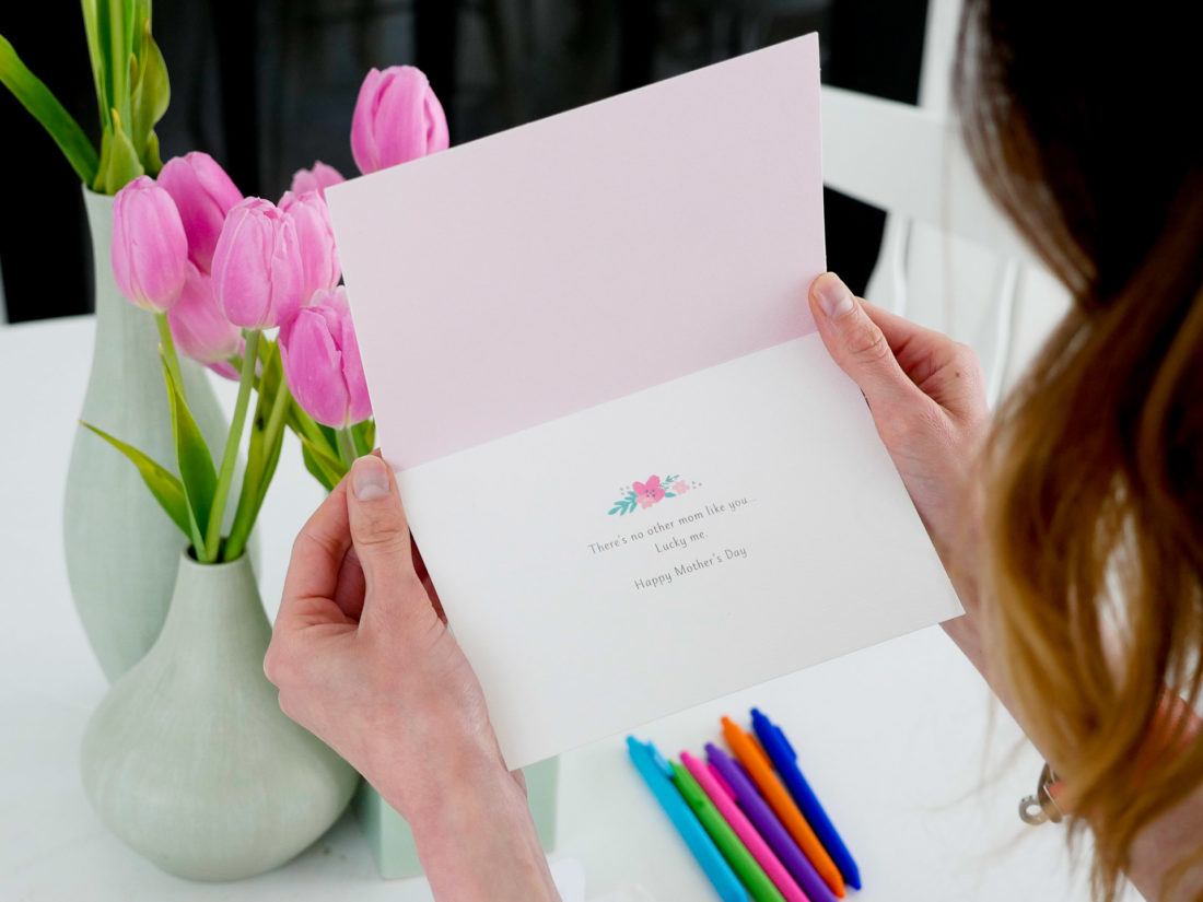 Eva Amurri Martino selects a floral, raised motif Mother's Day card to fill out for her Mother