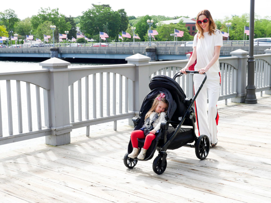Eva Amurri Martino walks with her two children in a Baby Jogger Stroller down the street in downtown Westport