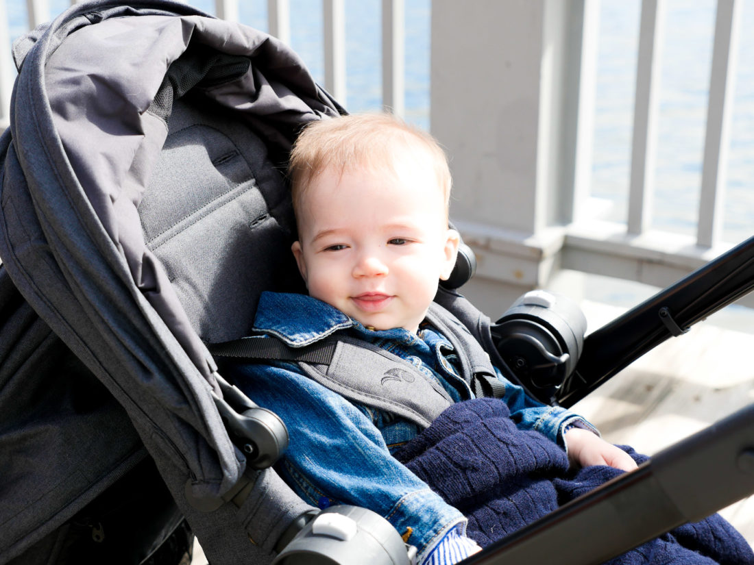 Major Martino wears a denim jacket and sits in his Baby Jogger stroller