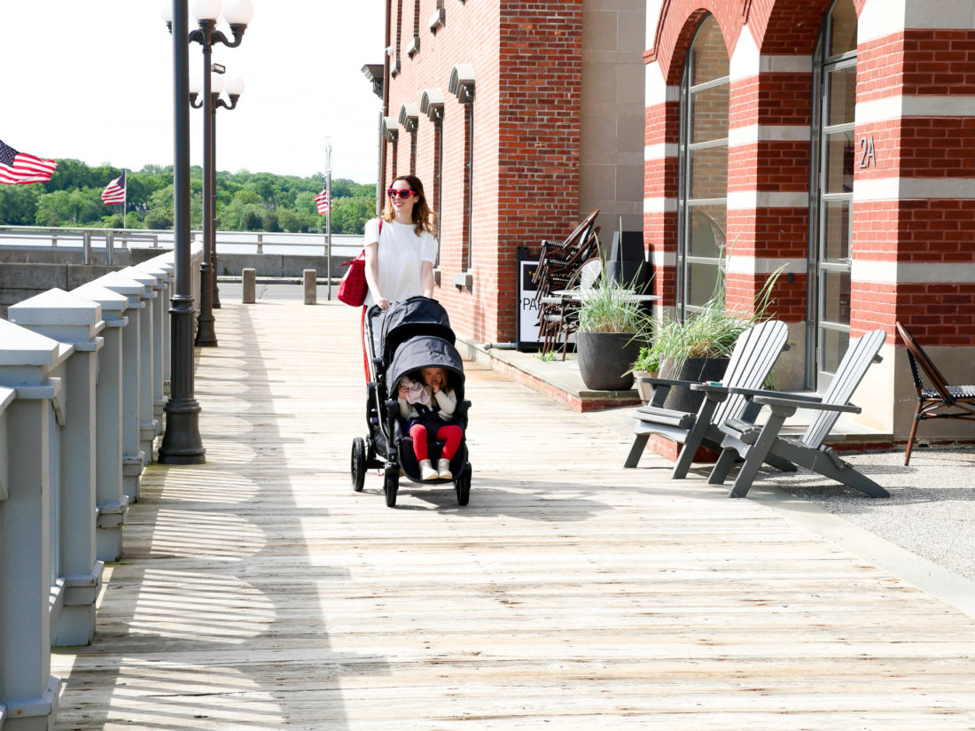 Eva Amurri Martino walks with her two children in a Baby Jogger Stroller down the street in downtown Westport