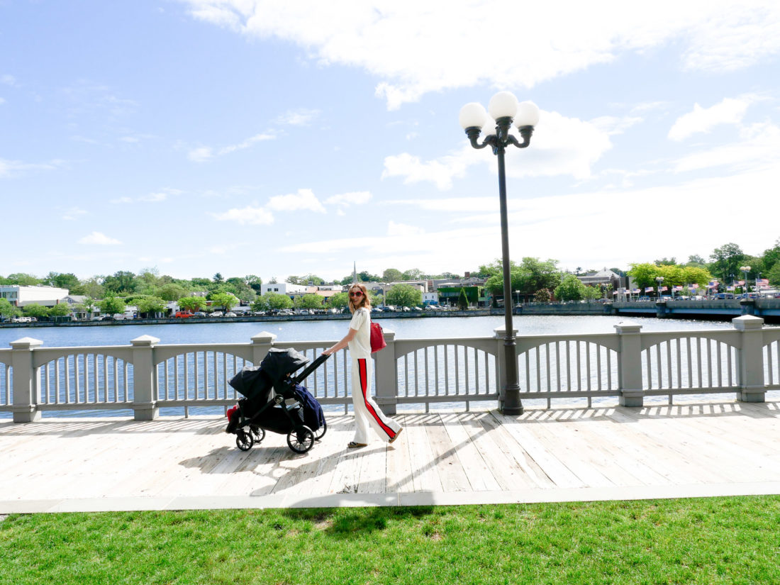 Eva Amurri Martino walks with her two children in a Baby Jogger Stroller down the street in downtown Westport