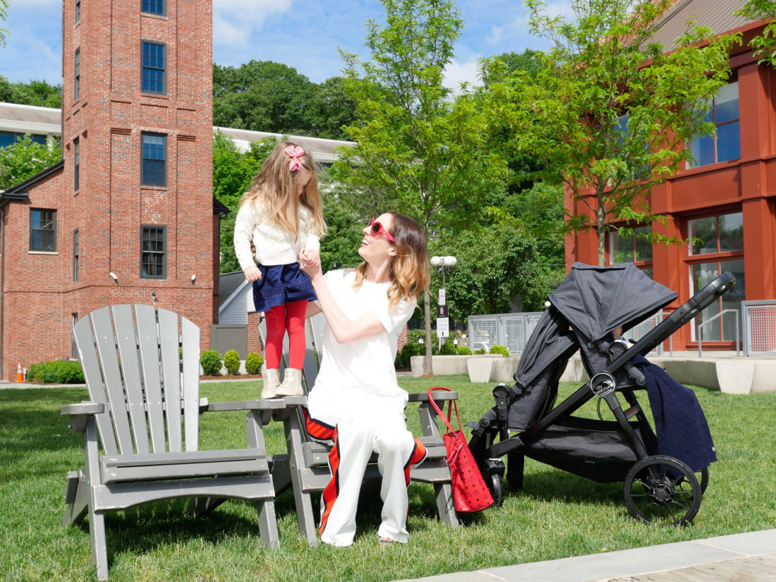 Eva Amurri Martino sits outside with daughter Marlowe and son Major in a stroller