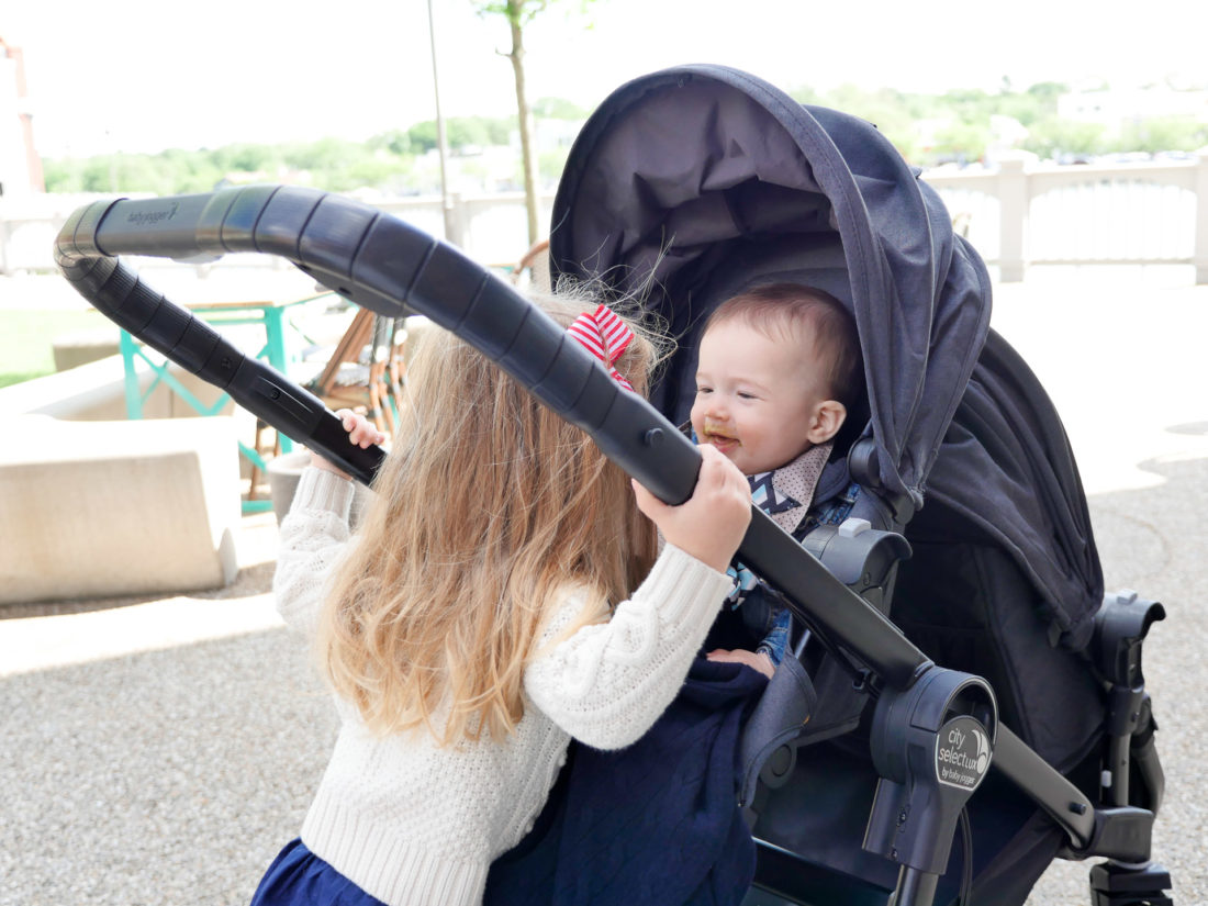 Marlowe Martino check on little brother, Major, in his stroller.