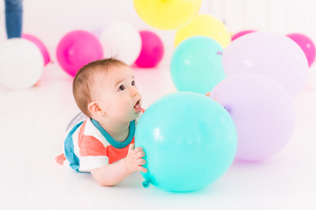 Major Martino plays with multicolored balloons for the REZTT second anniversary