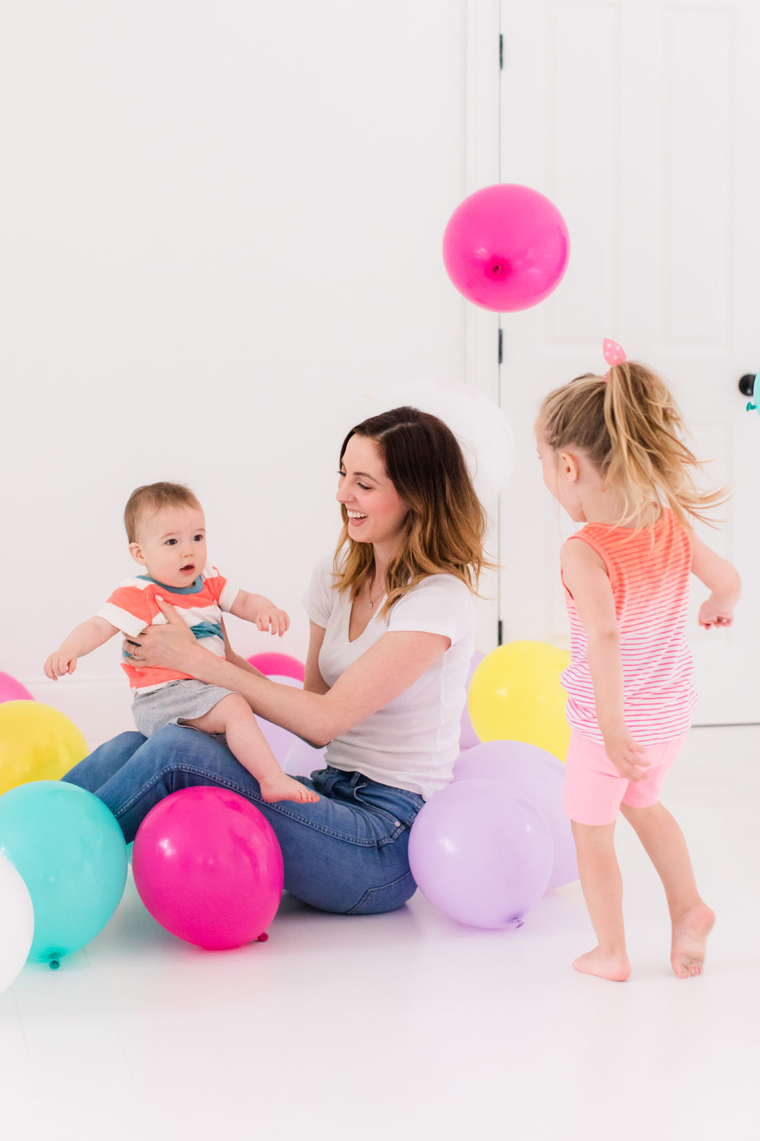 Eva Amurri Martino stands in the REZTT studio filled with balloons to celebrate the second anniversary of the blog