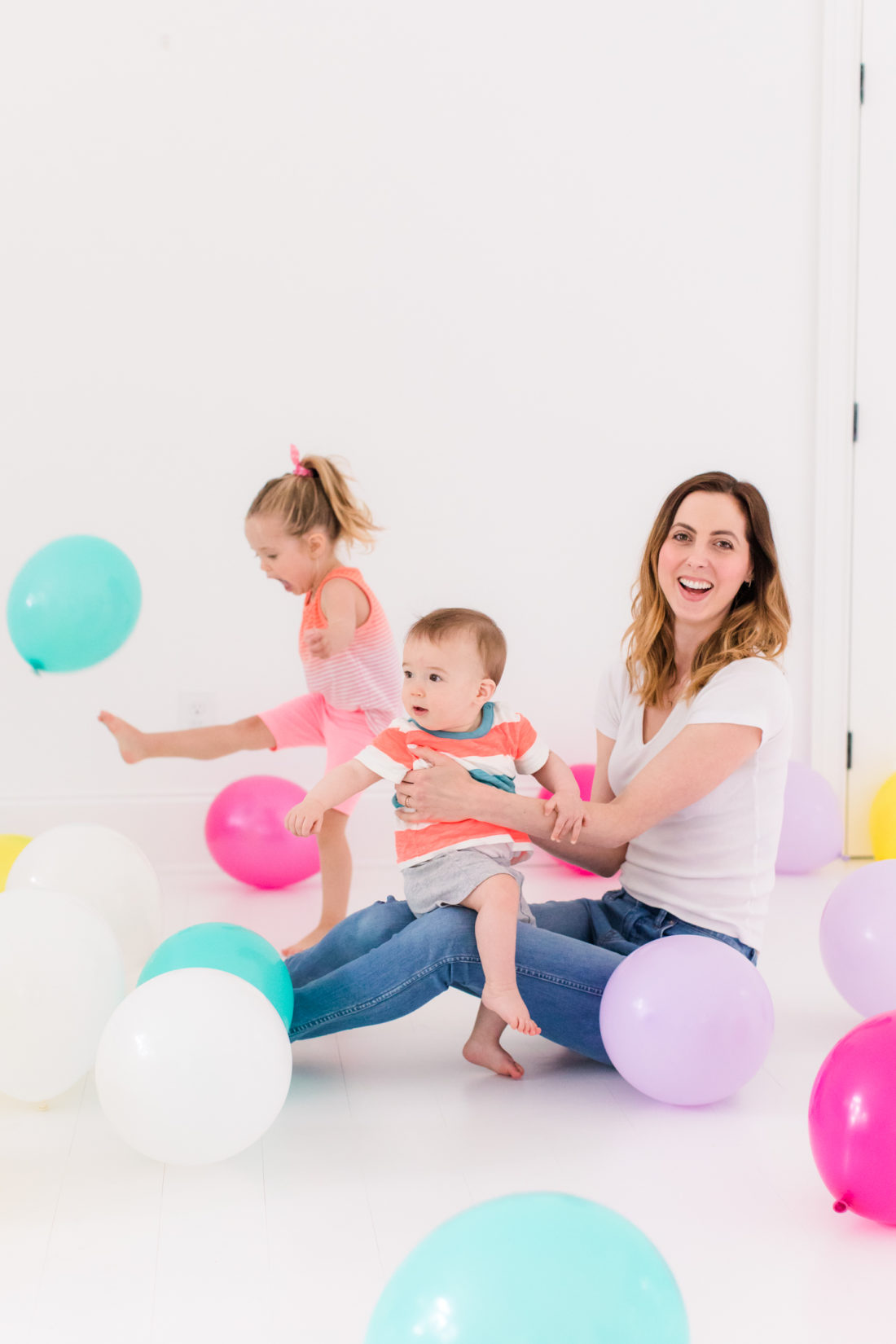 Eva Amurri Martino stands in the REZTT studio filled with balloons to celebrate the second anniversary of the blog