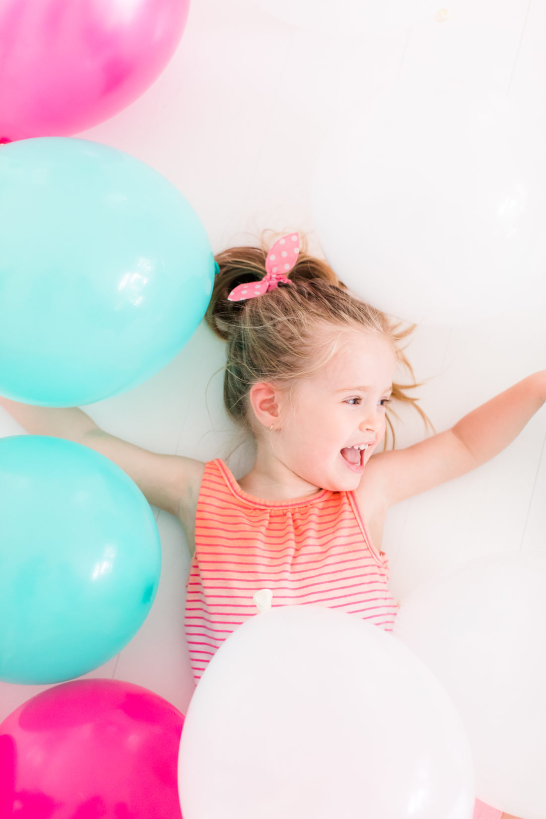 Marlowe Martino plays in multicolored balloons for the REZTT second anniversary