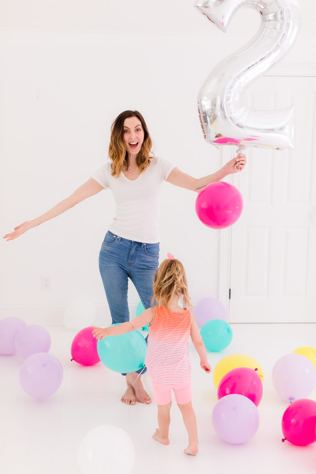 Eva Amurri Martino stands in the REZTT studio filled with balloons to celebrate the second anniversary of the blog