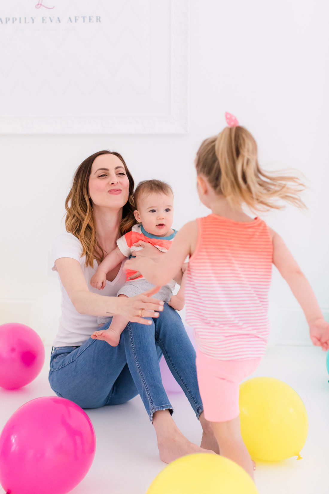 Eva Amurri Martino stands in the REZTT studio filled with balloons to celebrate the second anniversary of the blog