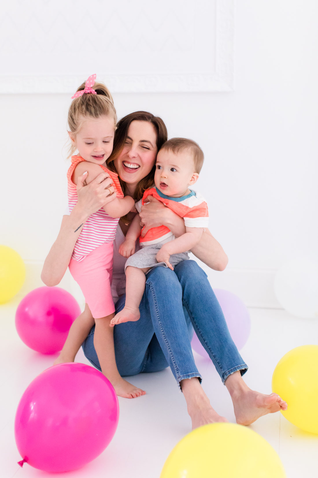 Eva Amurri Martino stands in the REZTT studio filled with balloons to celebrate the second anniversary of the blog