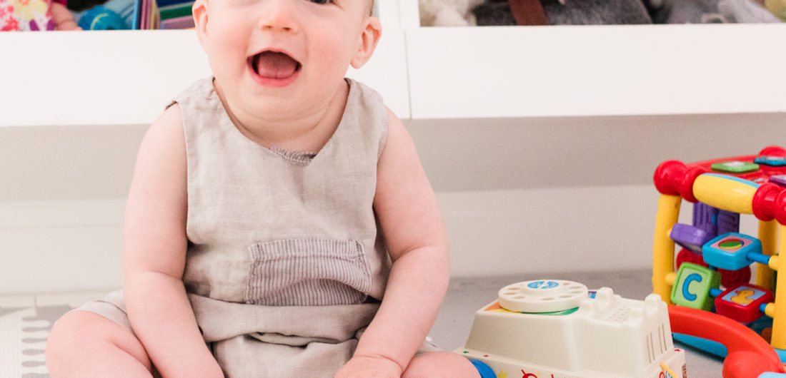 Eight month old Major Martino sits among his colorful toys at home in Connecticut