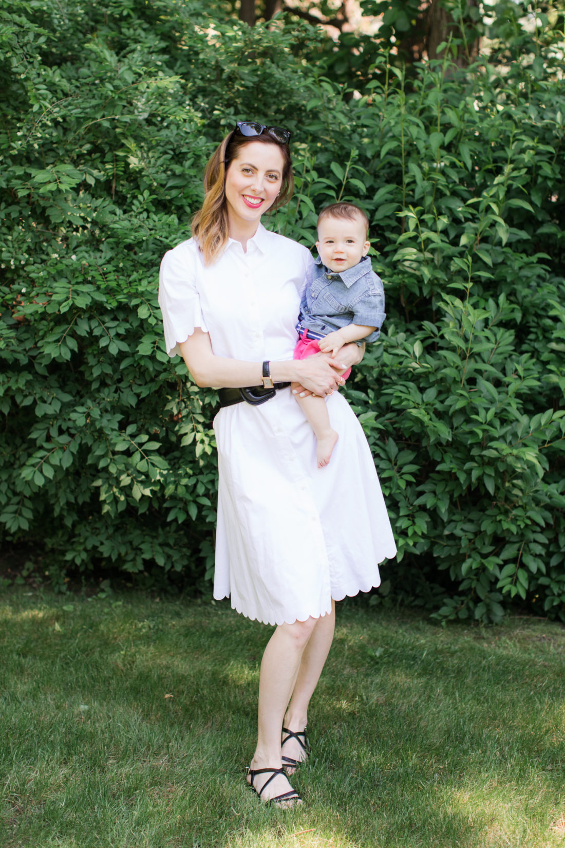 Eva Amurri Martino of lifestyle and motherhood blog REZTT relaxes on a picnic blanket with her two children Marlowe and Major