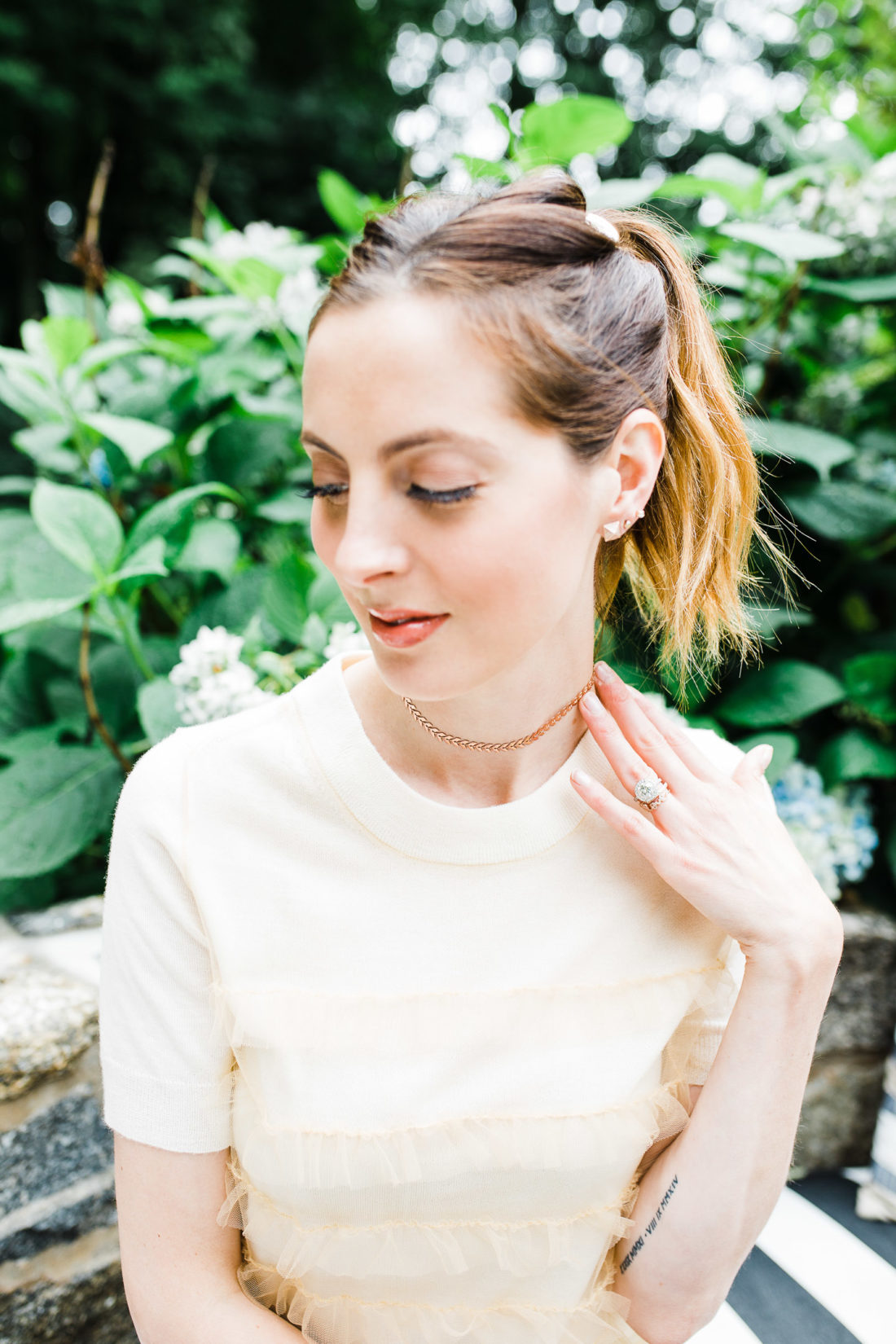 Eva Amurri Martino wears a champagne colored sweater top and a gold Argento Vivo choker
