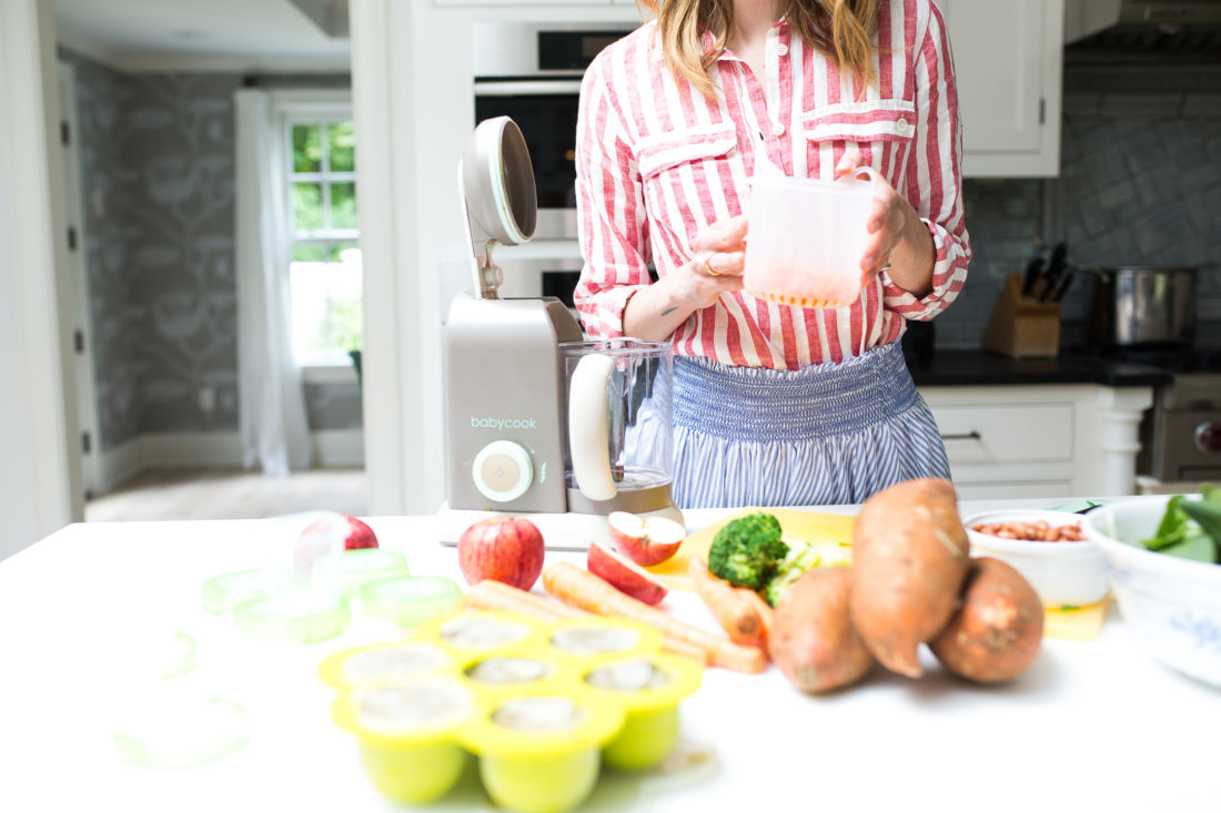 Eva Amurri Martino drops chopped carrots in to the steamer of her beaba babycook pro baby food maker