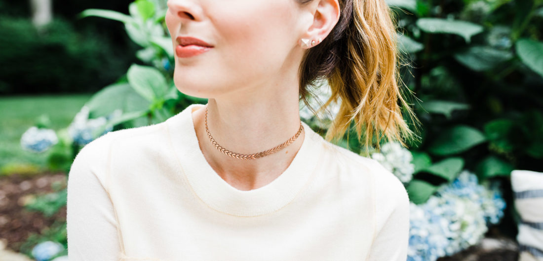 Eva Amurri Martino wears a champagne colored sweater top and a gold Argento Vivo choker
