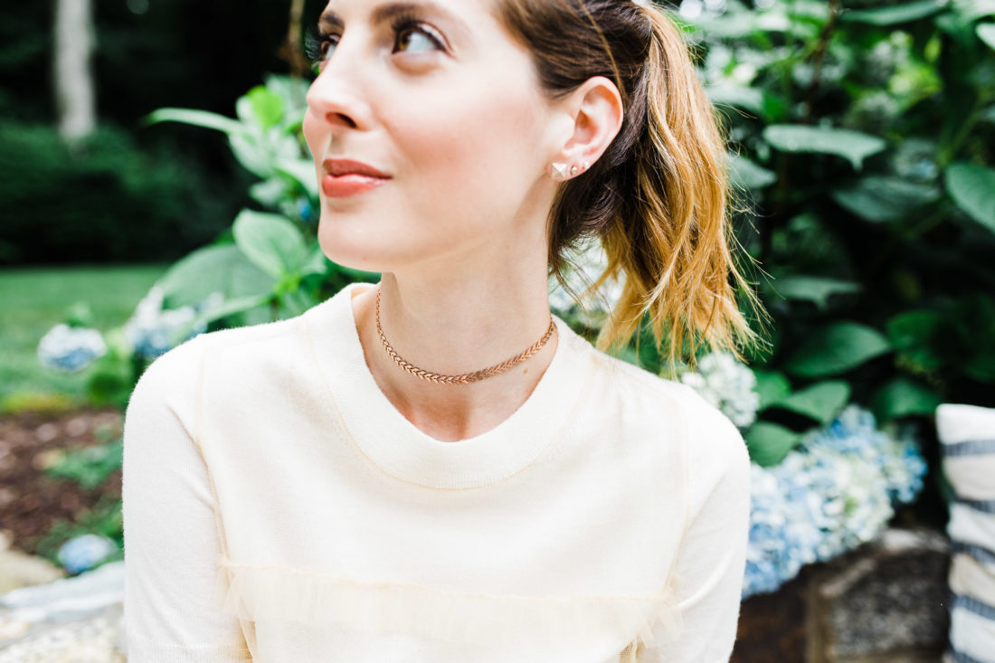 Eva Amurri Martino wears a champagne colored sweater top and a gold Argento Vivo choker