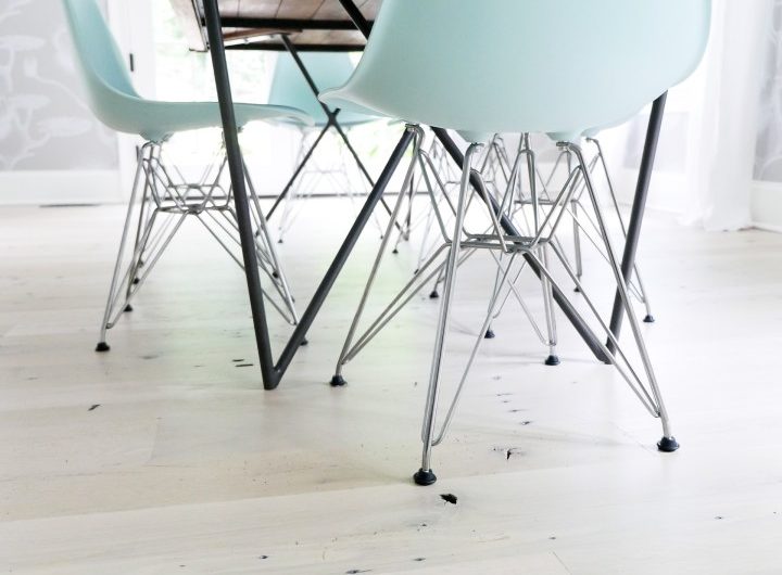 robin's egg blue molded plastic eames chairs in the dining room of Eva Amurri Martino's Connecticut home