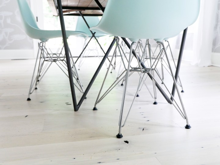 robin's egg blue molded plastic eames chairs in the dining room of Eva Amurri Martino's Connecticut home