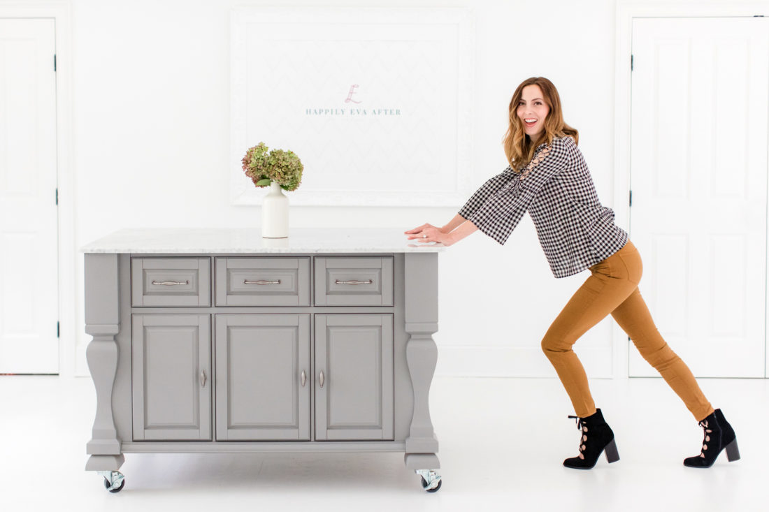 Eva Amurri Martino pushes her grey crafting island across the floor of the REZTT studio
