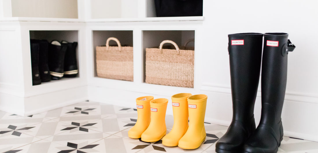 The black and white tiled mud room, with natural woven accents, in Eva Amurri Martino's Connecticut home