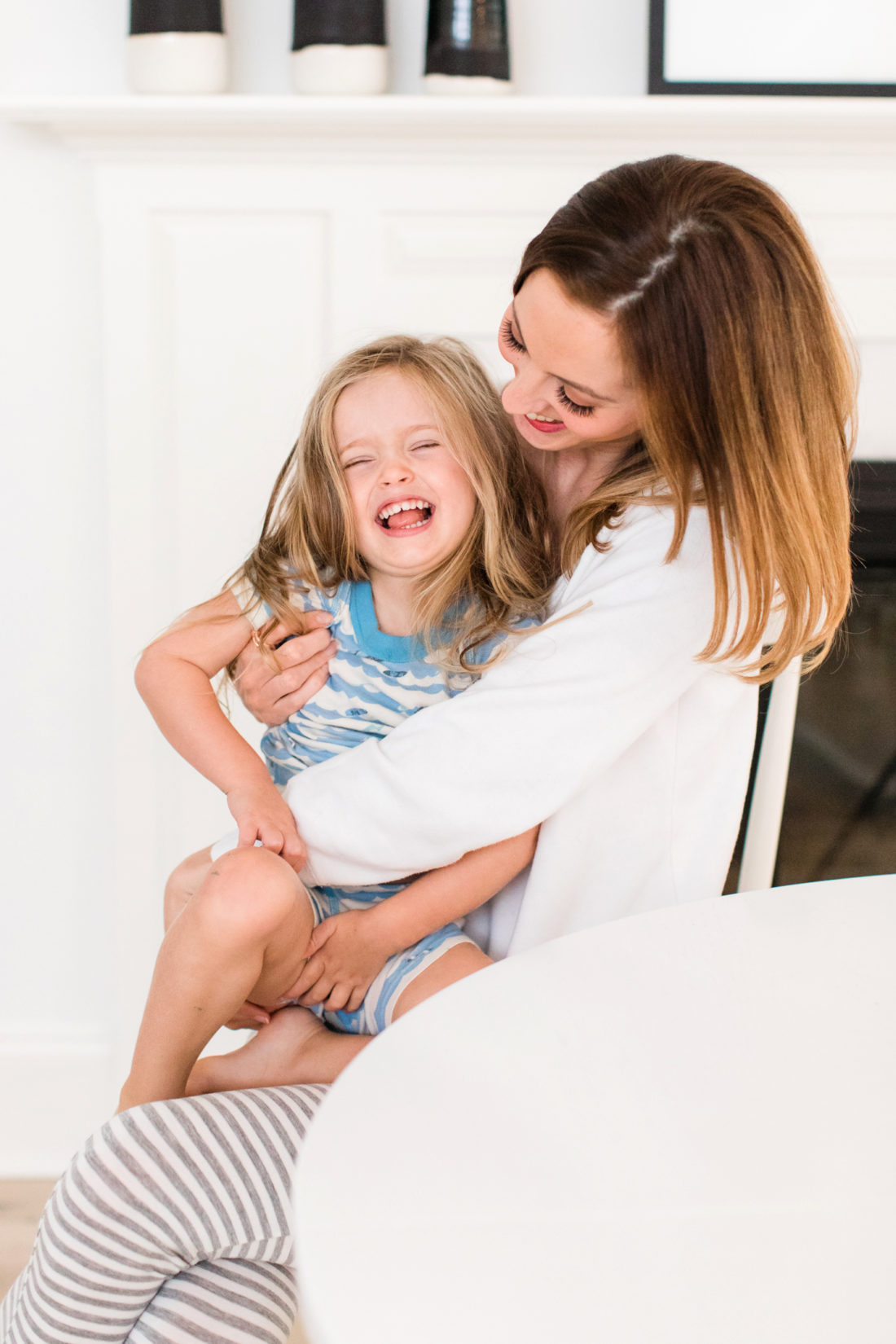 Eva Amurri Martino tickles daughter marlowe in the morning at the kitchen table in their conecticut home