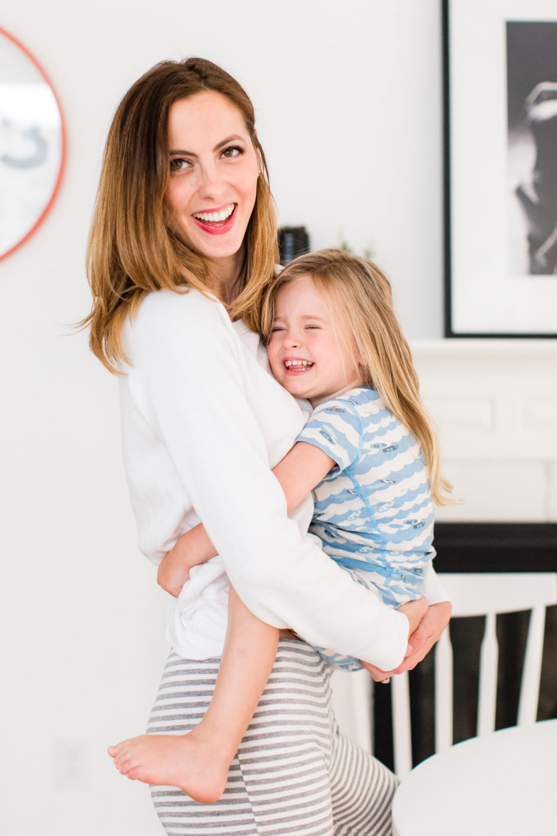 Eva Amurri Martino holds daughter Marlowe in her arms in the kitchen of her Connecticut home