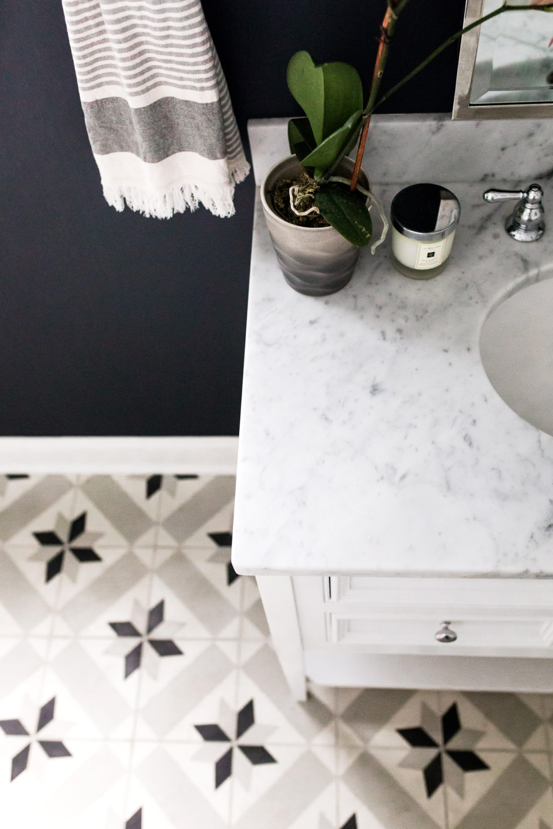 Eva Amurri Martino shares the full redesign of her black, white, and grey concept powder room in her Connecticut home