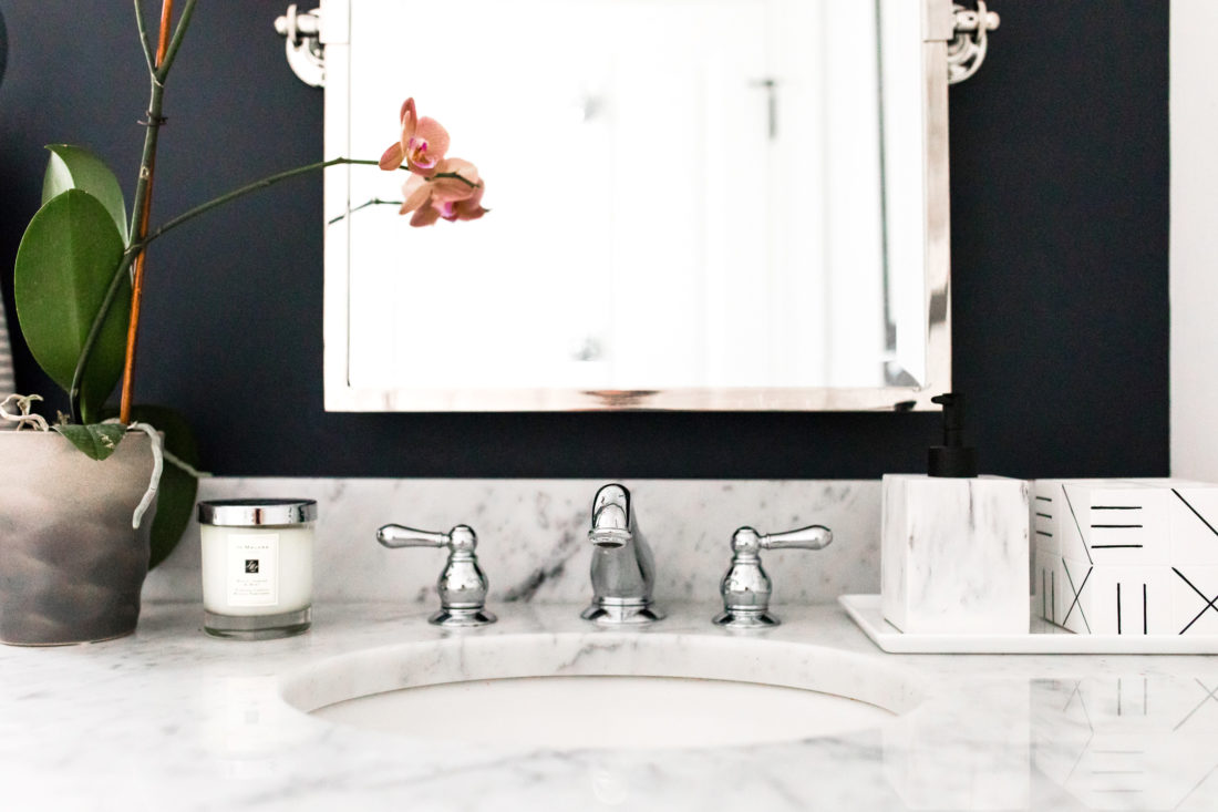 The faucet and marble vanity of Eva Amurri Martino's powder room in her Connecticut home