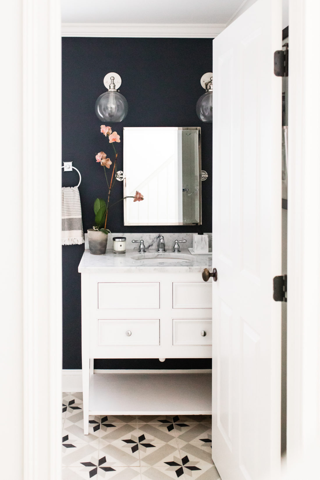 Eva Amurri Martino shares the black, white, and grey design of the powder room in her Connecticut home