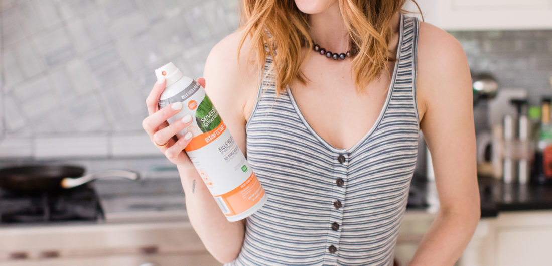 Eva Amurri Martino wears a striped bodysuit and white jeans and cleans her connecticut kitchen with seventh generation spray