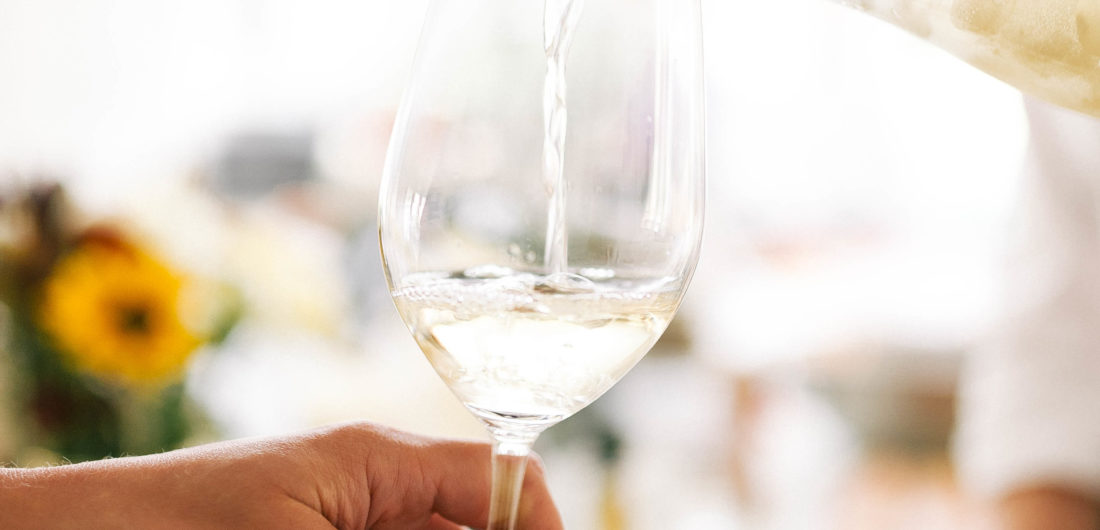 A glass of white wine is poured at Eva Amurri Martino's Connecticut home
