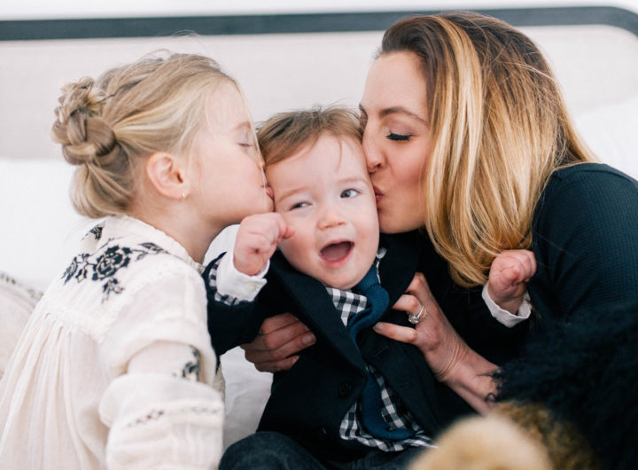 Eva Amurri Martino and her daughter Marlowe Mae Martino kissing son Major James Martino on the bed in their Connecticut home.