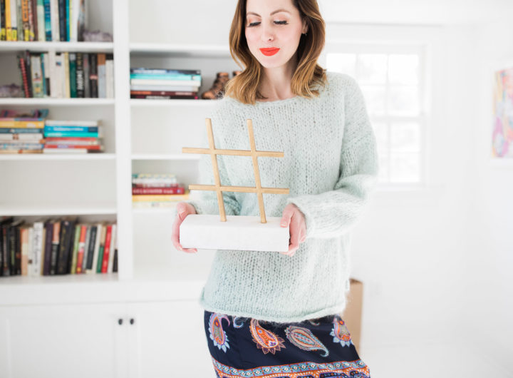 Eva Amurri Martino holds a marble and brass hashtag object in the studio of her Connecticut home