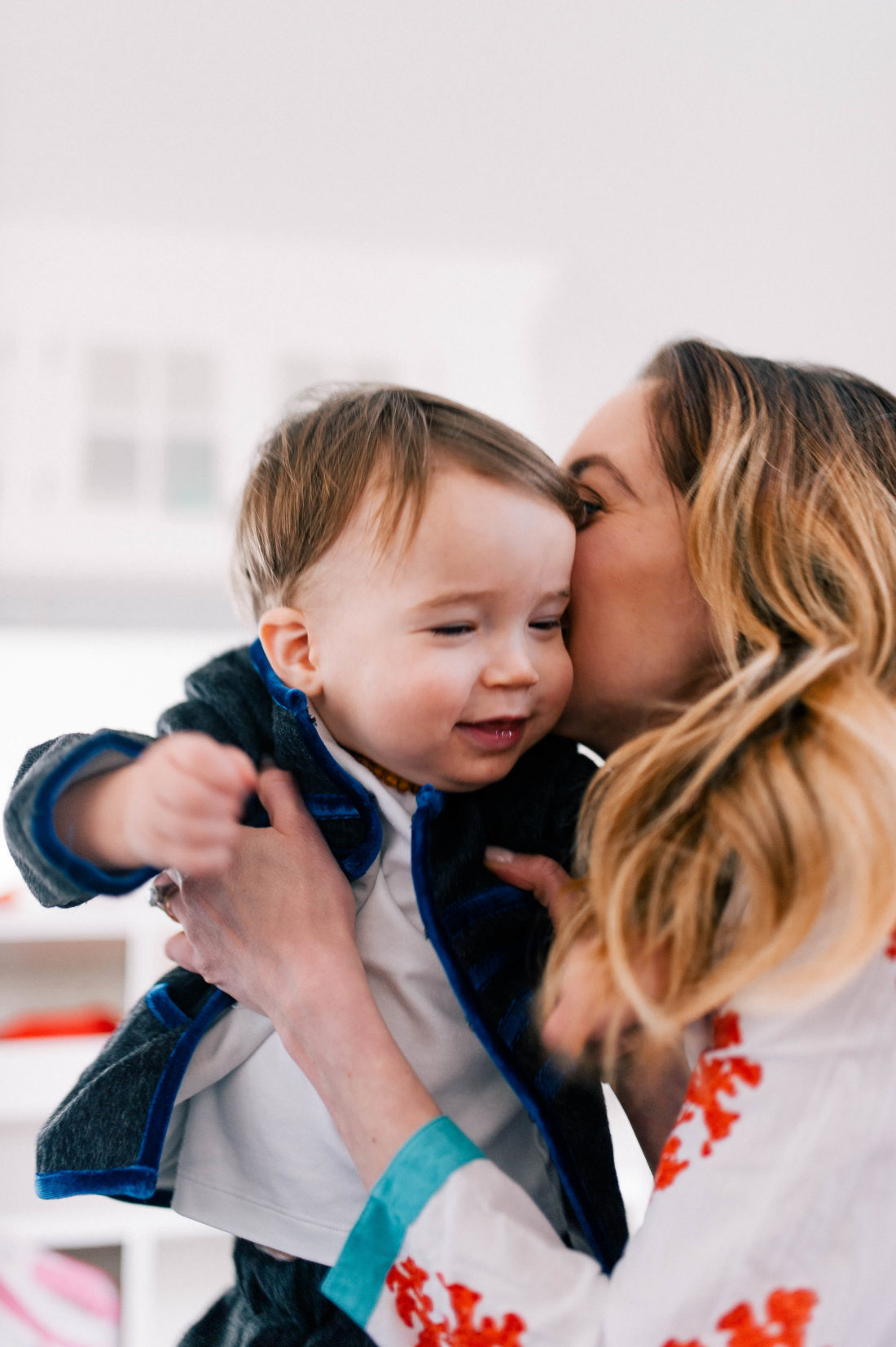 Eva Amurri Martino kisses and snuggles one year old son Major James in the family room of their Connecticut home